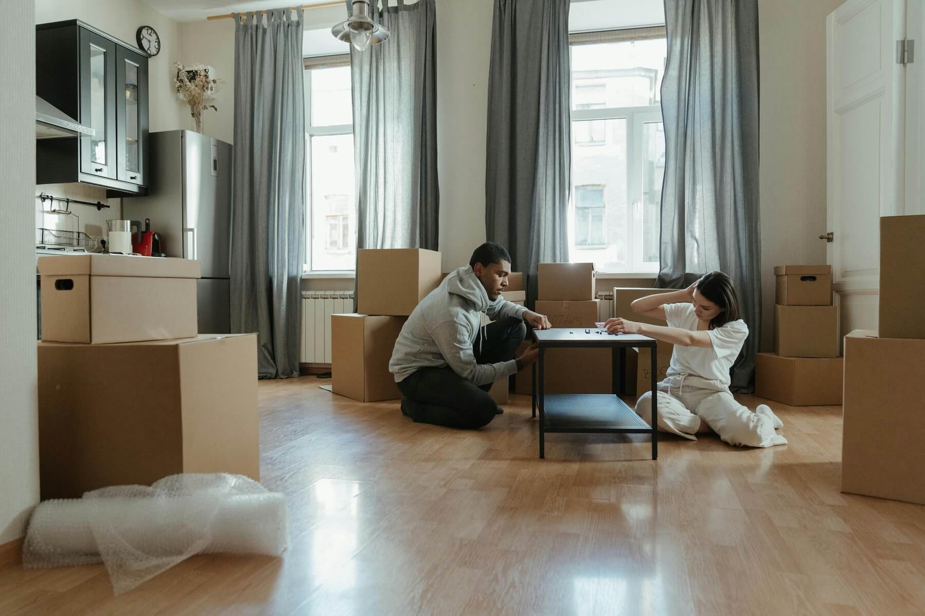 Frustrated home owners packing for a move.